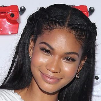 Chanel Iman con cornrows en un evento publicitario